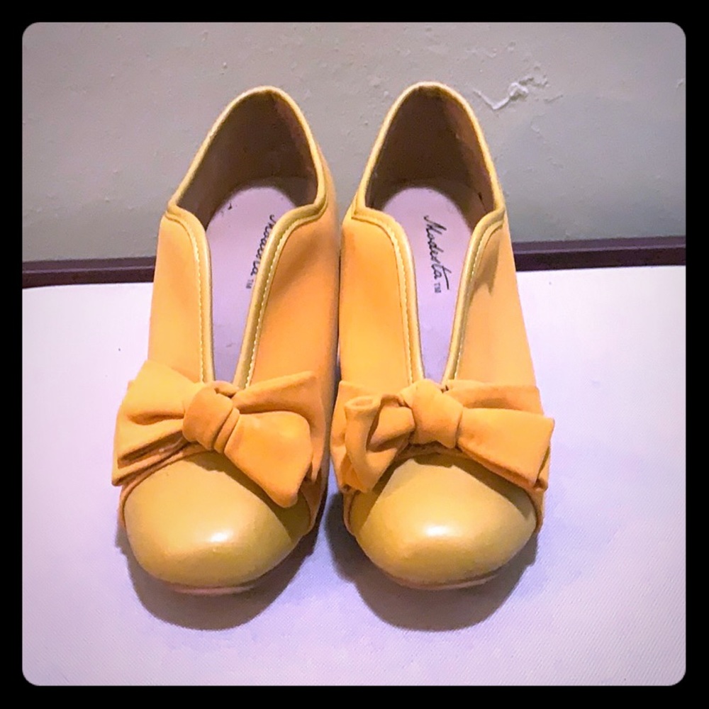 Modesta yellow heels
